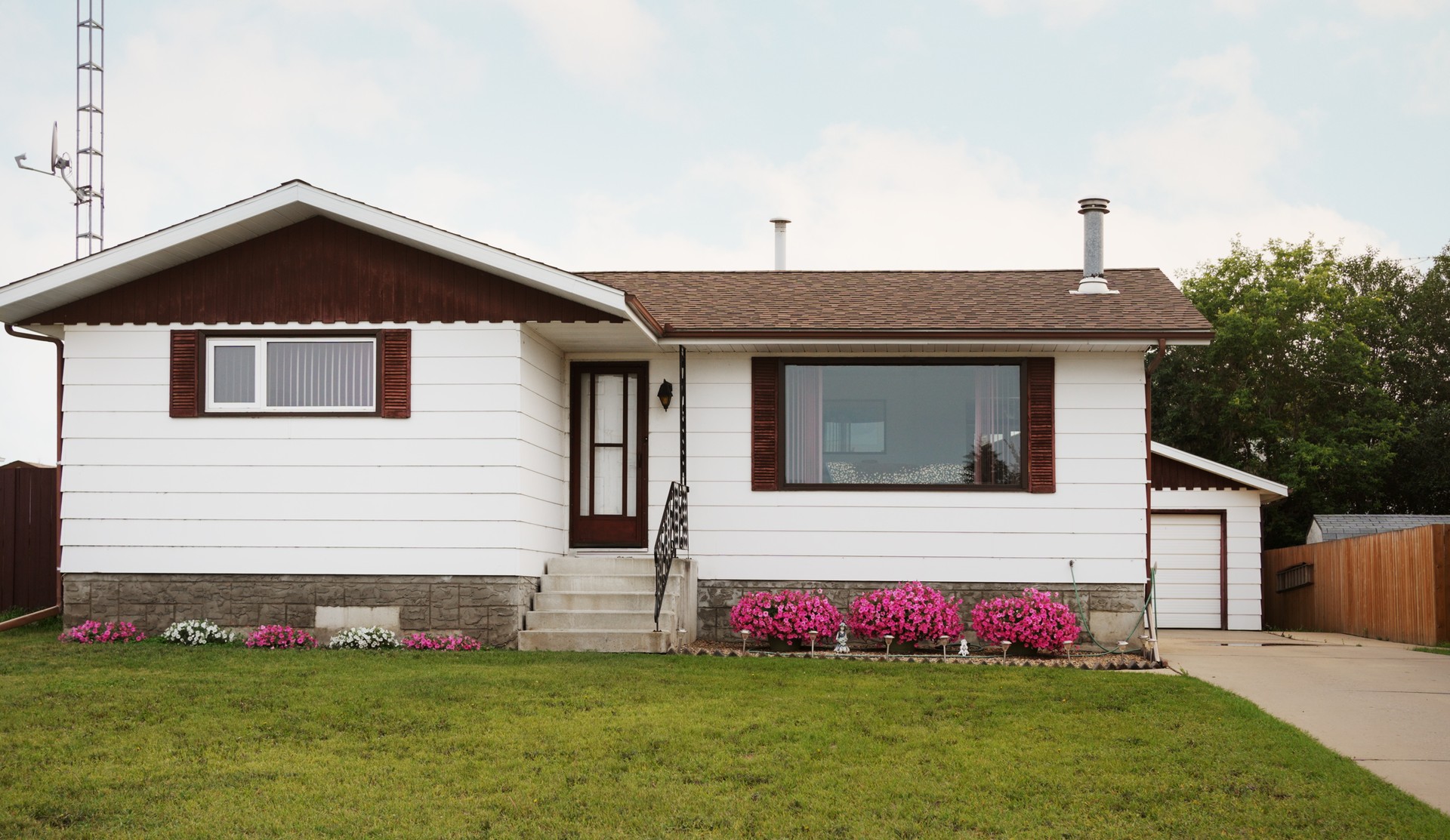 Bungalow style home with a yard in a suburb